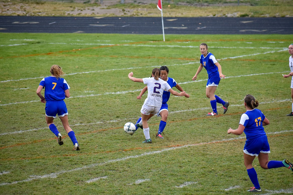 Libby sophomore Ruby Martin attempts to stop a shot on goal by Polson sophomore Autumn Burland early in the first half Saturday. (Ben Kibbey/The Western News)