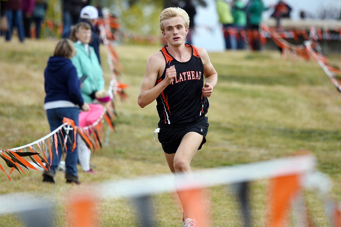 Flathead's Ben Perrin heads down the final stretch at the Glacier Invitational cross-country race at Rebecca Farm on Wednesday. (Casey Kreider/Daily Inter Lake)