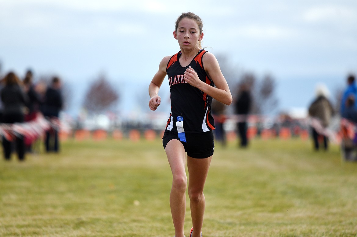 Flathead's Tori Noland-Gillespie crosses the finish line at the Glacier Invitational cross-country race at Rebecca Farm on Wednesday. (Casey Kreider/Daily Inter Lake)