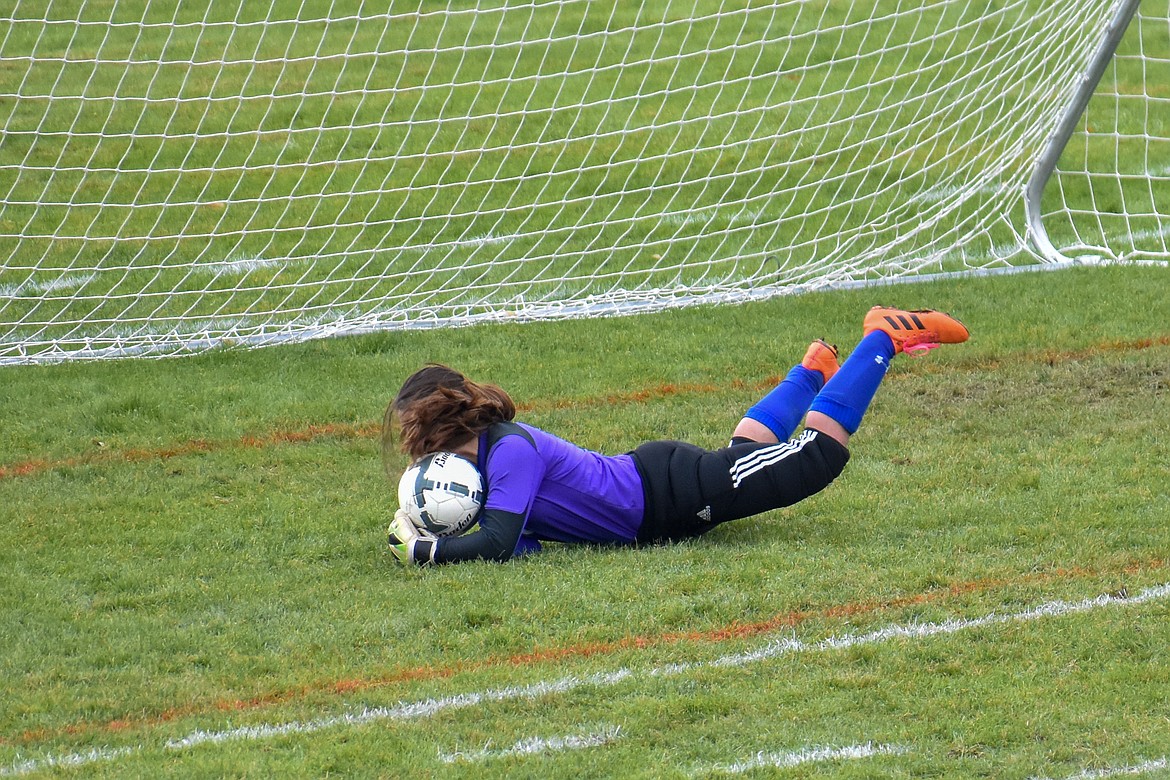 Libby sophomore goalkeeper Bethany Thomas dives in for the save early in the first half Saturday. (Ben Kibbey/The Western News)