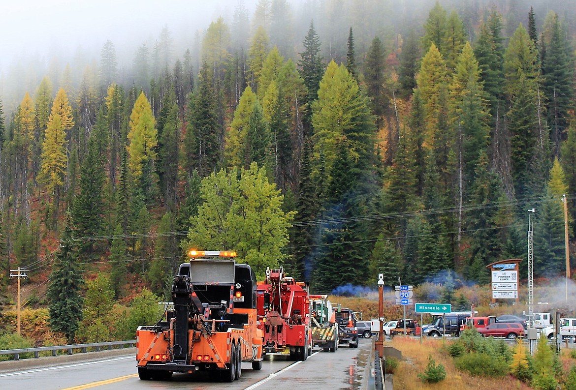 Trucks from William Mellen&#146;s businesses, West End Towing and Recovery and Big Sky Towing wait to begin a procession in his honor at Lookout Pass on Oct. 6. He passed away on Sept. 14 and services were held in Superior on Saturday.