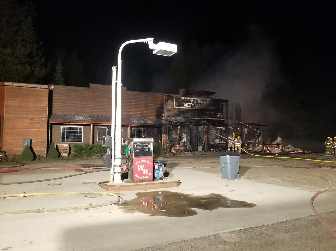 (Courtesy Photo)
Hall Mountain firefighters getting the fire contained at the Wild Horse Mercantile.