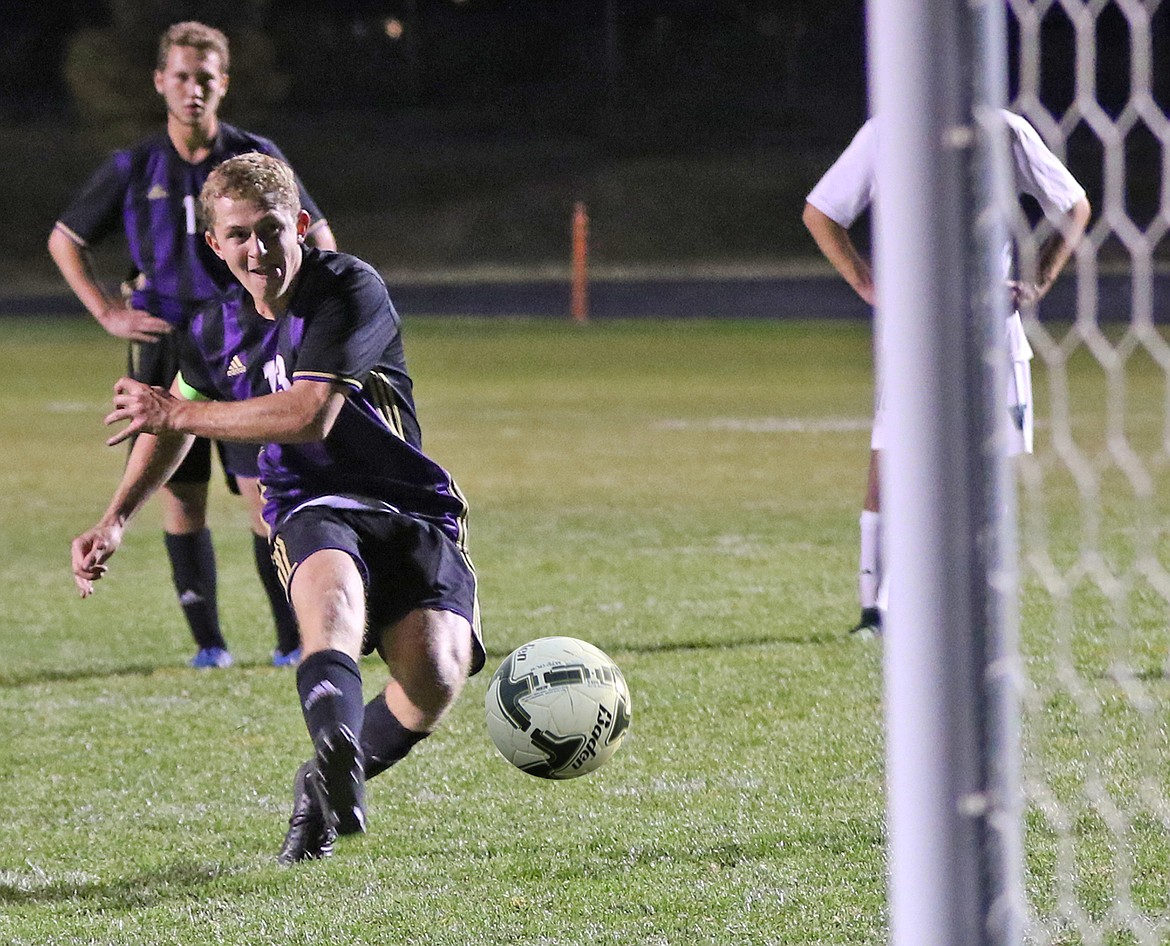 Max Moderie rifles the ball into the goal during a penalty kick in Polson&#146;s 3-3 tie with Whitefish. (Bob Gunderson for the Lake County Leader)