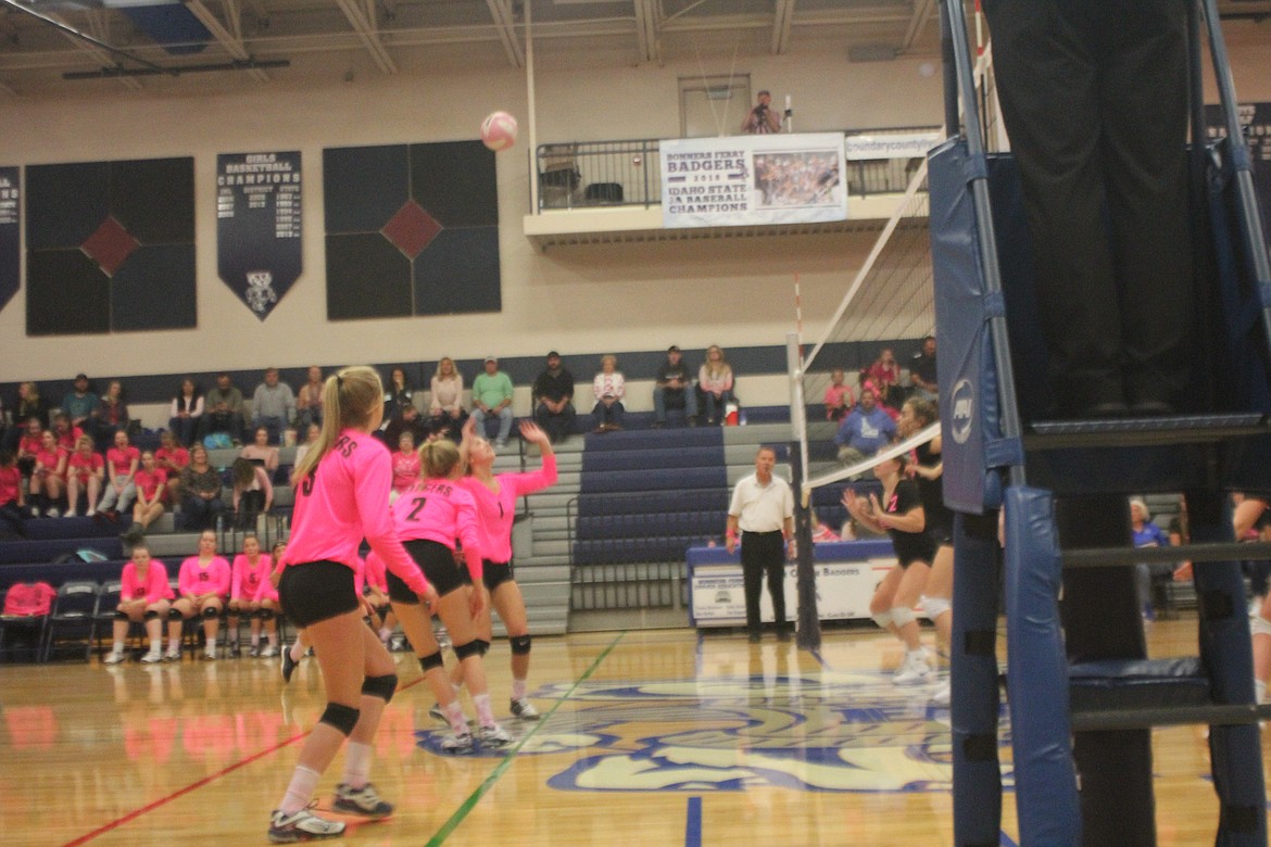 Maecie Lierman getting under the ball, colored pink and white in honor of the event.