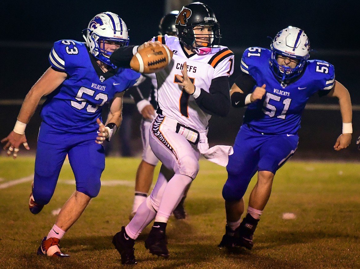 Ronan quarterback Eric Dolence looks for a receiver against the Columbia Falls defense Friday. (Jeremy Weber photo)