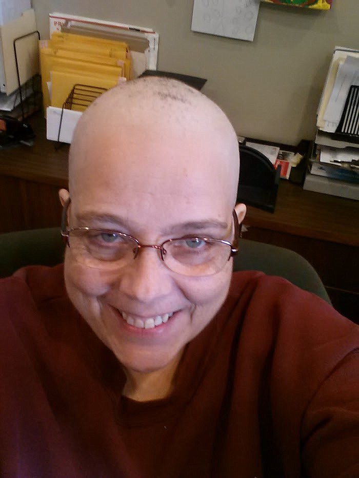 Corey Brock had a wig to wear once she began losing hair, but she said she opted against it, even while she was at work. (Photo provided)