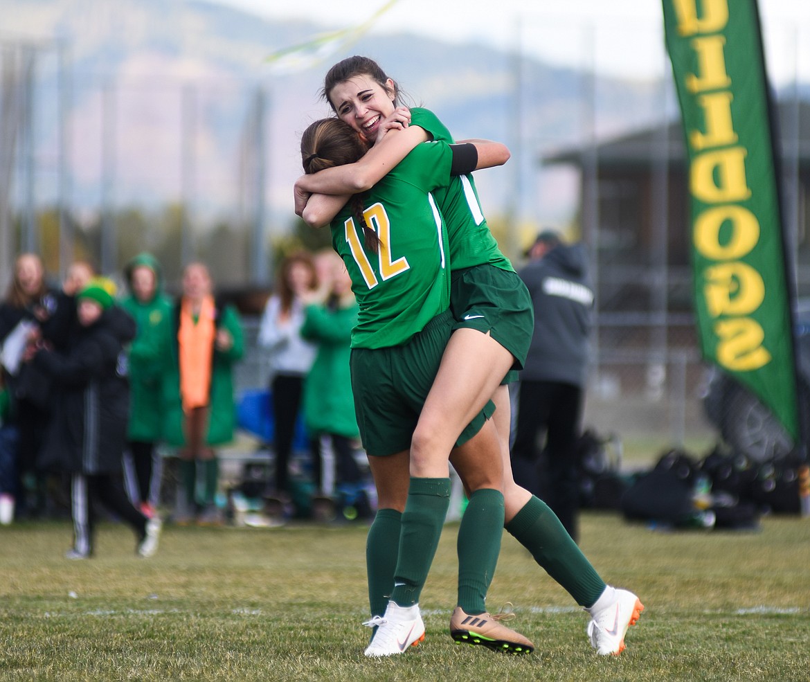 Olivia Potthoff celebrates with Anna Cook after Cook's tying goal in Saturday's quarterfinal match against Hamilton at Smith Fields.