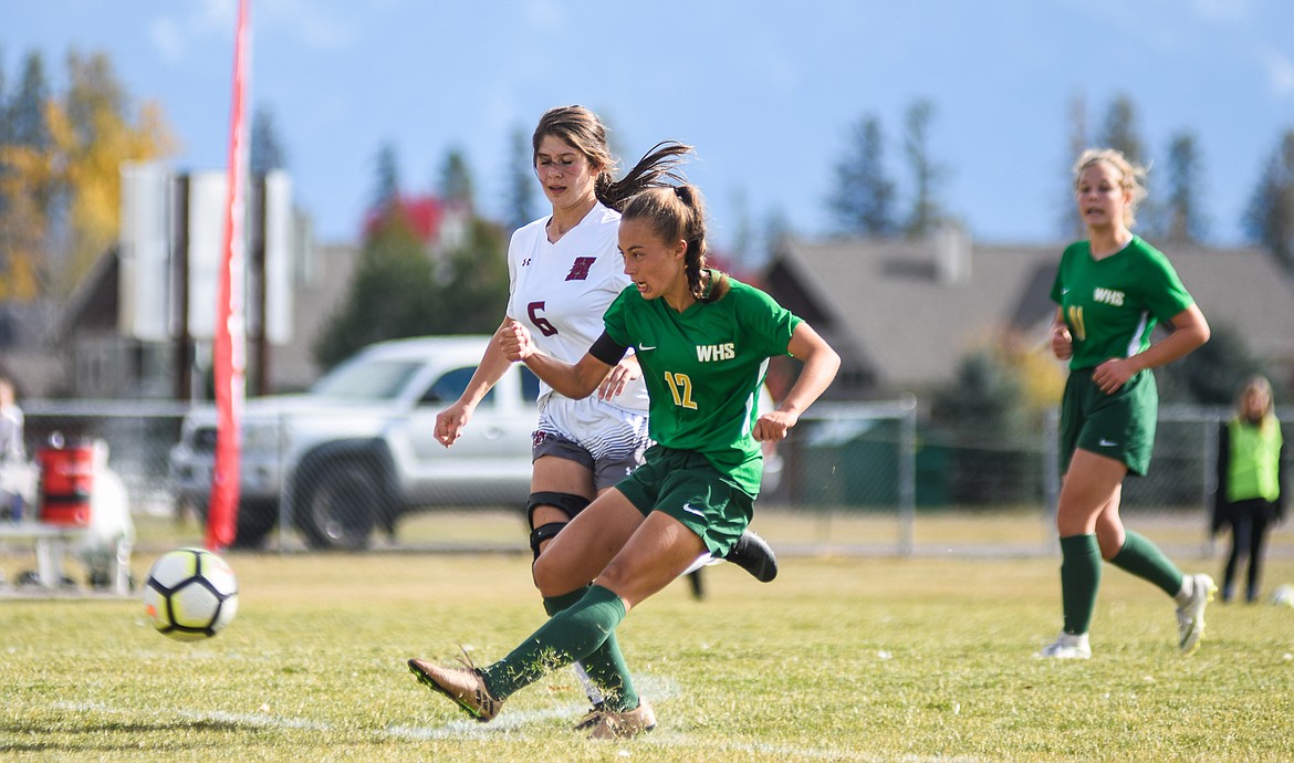 Anna Cook fires a shot against Hamilton in Saturday&#146;s quarterfinal match at Smith Fields. (Daniel McKay photos/Whitefish Pilot)