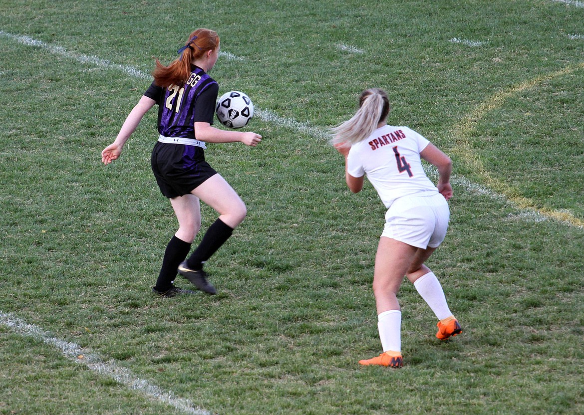 Photo by Josh McDonald
Kristen Kopf uses her knee to keep the ball away from a Priest River defender during their match last week at Teeters Field.