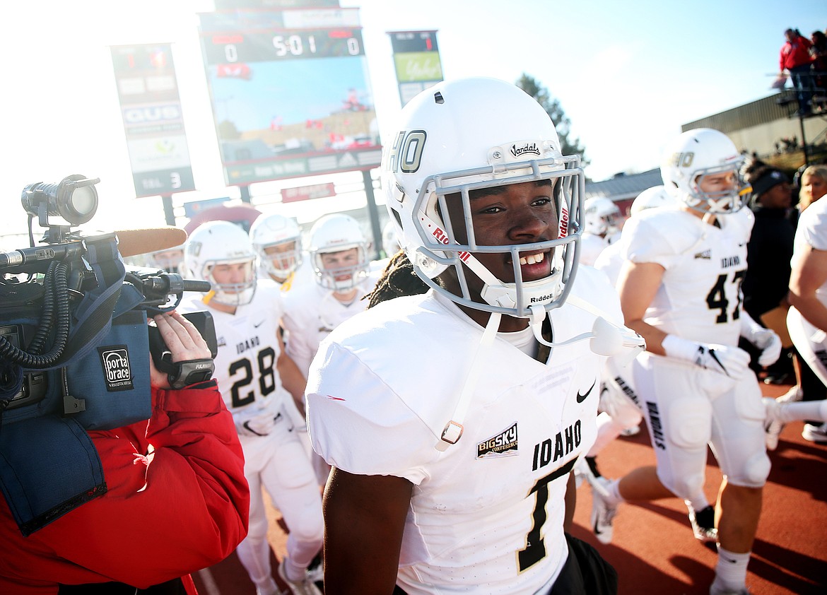Idaho wide receiver Cutrell Haywood runs onto the field with his Vandal teammates before kickoff against Eastern Washington.