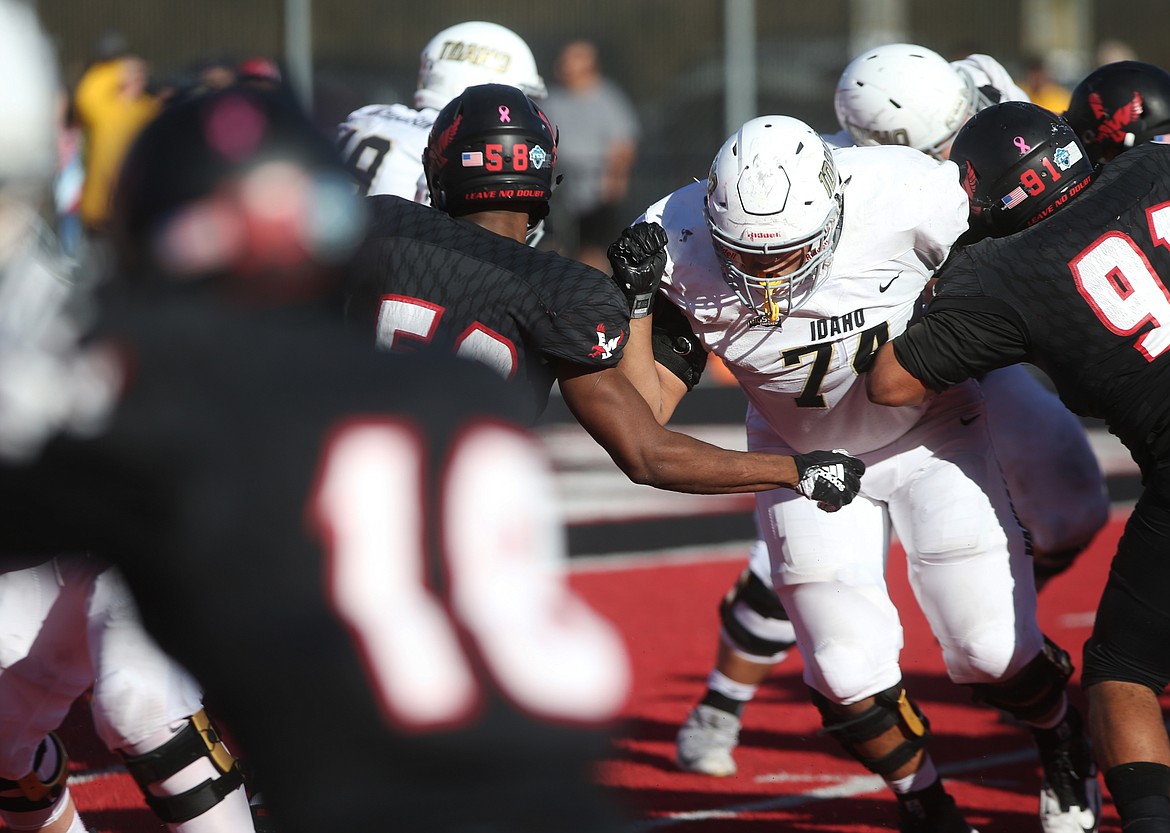 University of Idaho lineman Noah Johnson rushes upfield for a block during a running play in Saturday's game at Pacific Roos Field in Cheney. (LOREN BENOIT/Press)