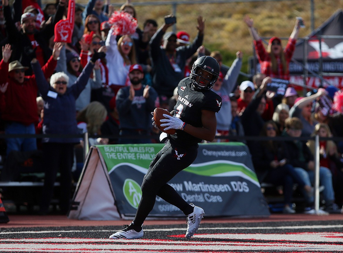 Eastern Washington University quarterback Eric Barriere looks back to his team after crossing the goal line for a rushing touchdown against University of Idaho on Saturday in Cheney. (LOREN BENOIT/Press)