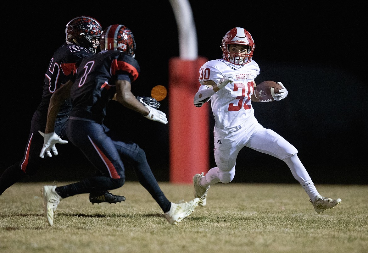 (Photo by JASON DUCHOW PHOTOGRAPHY)
Sandpoint sophomore running back Braden Kappen, right, looks for daylight in the Bulldogs&#146; season ending loss to Hillcrest on Friday in Idaho Falls.