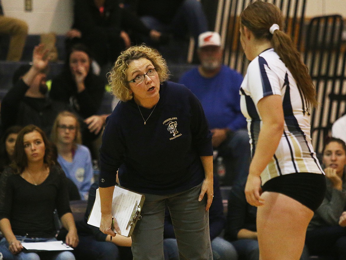 LOREN BENOIT/Press
Timberlake High volleyball coach Michelle Garwood gives instructions to Becca Malloy during last week&#146;s 3A District 1 championship match against Kellogg.