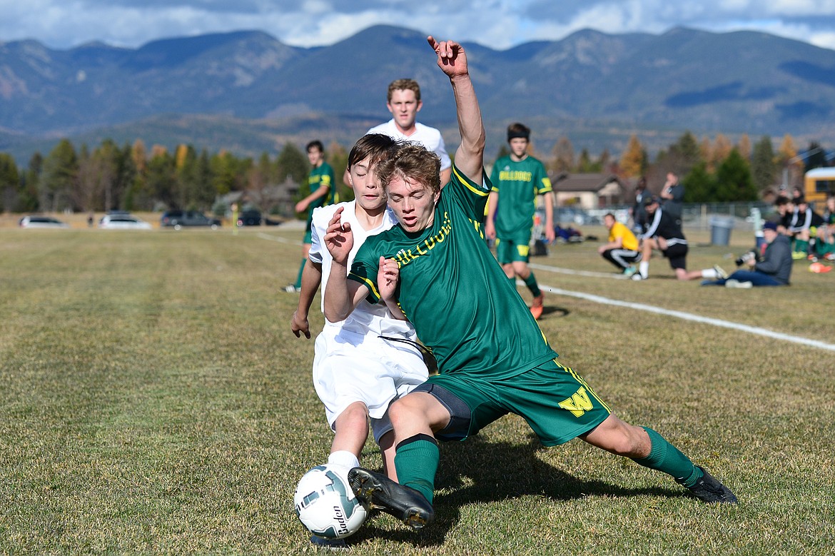 Whitefish's Casey Schneider (10) battles Polson's Jack Colton (8) for possession in the second half of the Class A state soccer championship at Smith Fields in Whitefish on Saturday. Whitefish won, 6-2. (Casey Kreider/Daily Inter Lake)