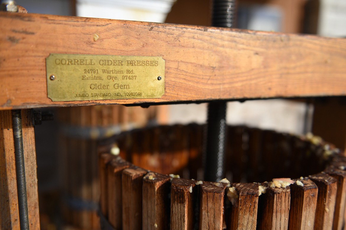 A Correll Cider Press is used to make the unpasteurized apple cider at Apple Barrel Country Market on Thursday. (Casey Kreider/Daily Inter Lake)