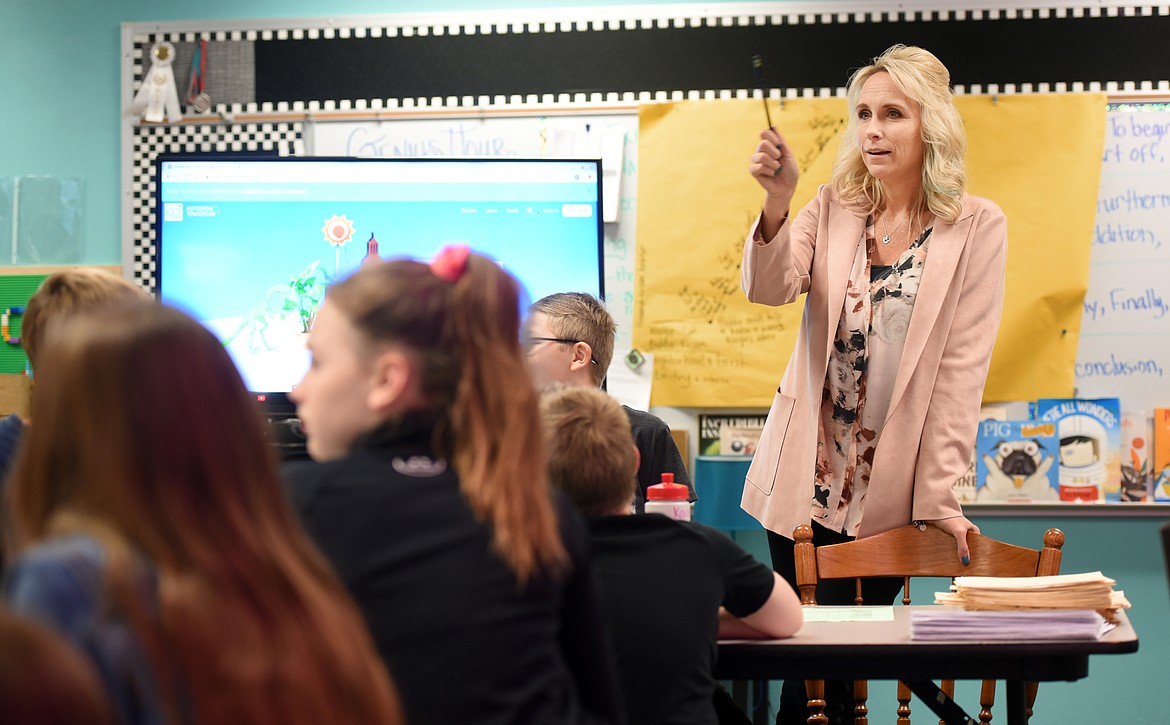 Teacher Shelley Emslie talks with fifth-graders at Swan River School on Tuesday, Oct. 23, about the 3-D printing project they are about to begin. The students are going to design pieces of coral that can be printed with 3-D printers. Emslie has been working to develop a 3-D curriculum across grade levels. (Brenda Ahearn/Daily Inter Lake)