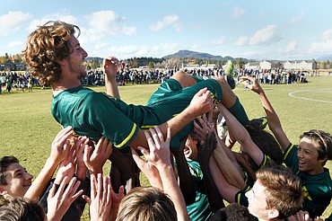 Whitefish teammates lift Xander Burger (16) after his five-goal performance lead the Bulldogs to a 6-2 victory over Polson in the Class A state soccer championship at Smith Fields in Whitefish on Saturday. (Casey Kreider/Daily Inter Lake)