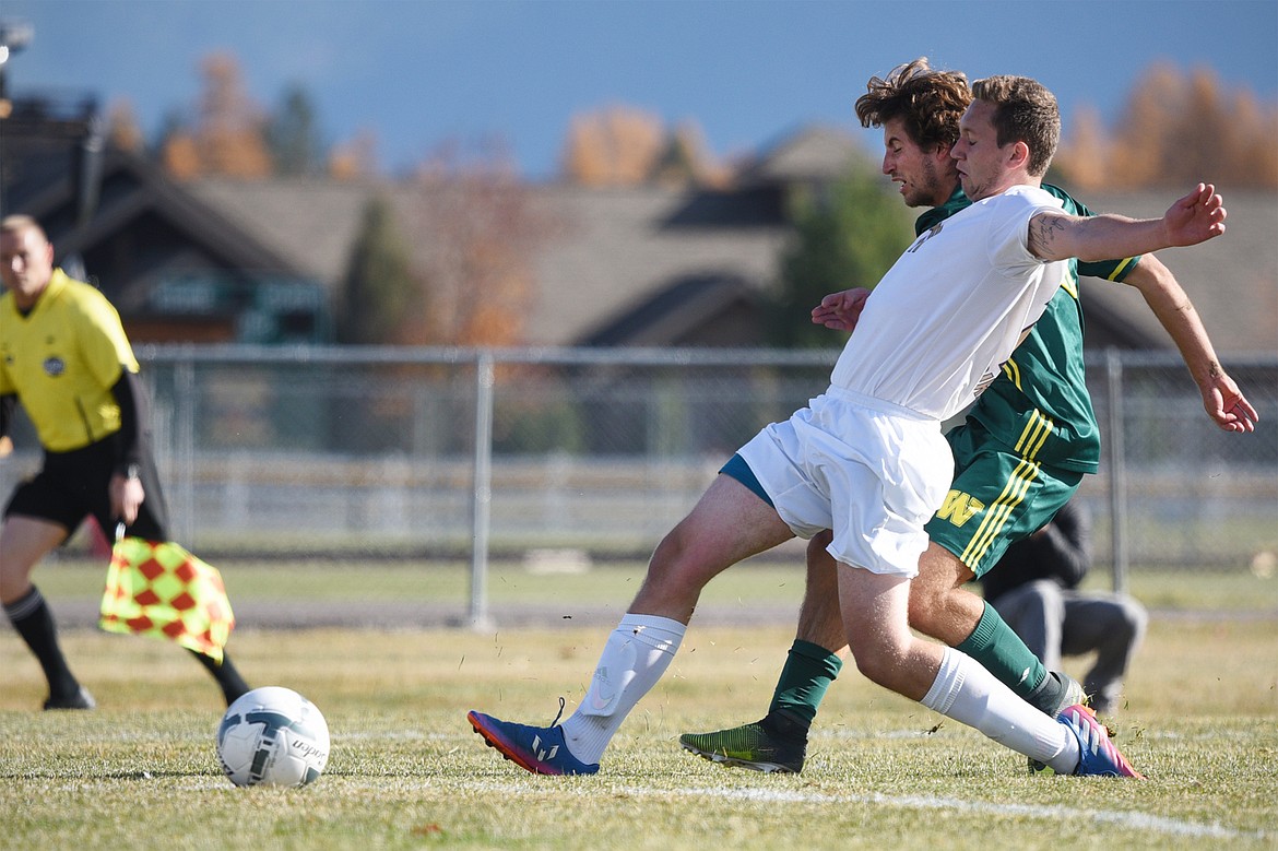 Whitefish's Xander Burger (16) scores his first of five goals against Polson in the Class A state soccer championship at Smith Fields in Whitefish on Saturday. Whitefish won, 6-2. (Casey Kreider/Daily Inter Lake)