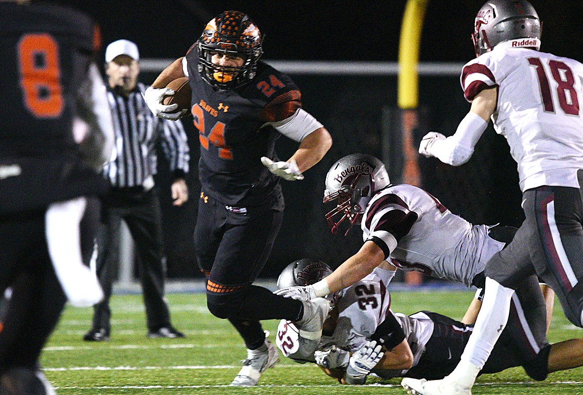 Flathead running back Blake Counts (24) looks for room to run in the third quarter against Helena at Legends Stadium on Friday. (Casey Kreider/Daily Inter Lake)