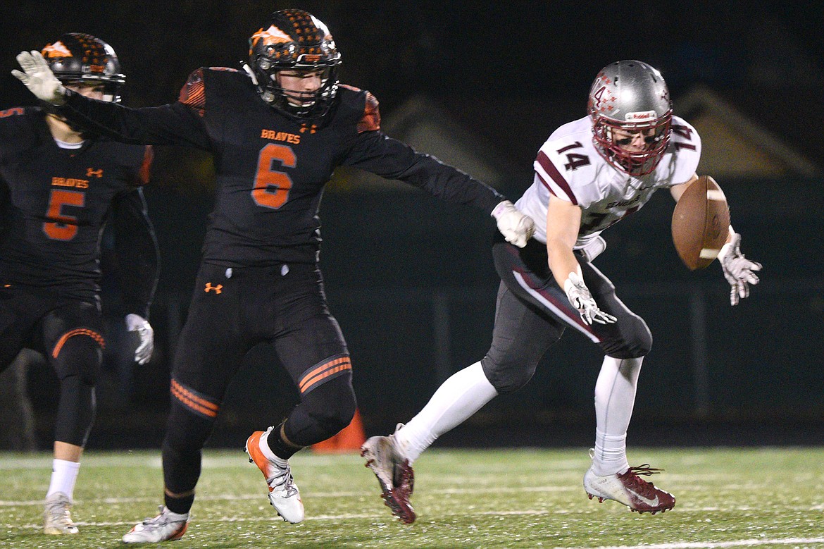 Helena wide receiver Zachary Spiroff (14) can't come up with a third-quarter reception against Flathead at Legends Stadium on Friday. (Casey Kreider/Daily Inter Lake)