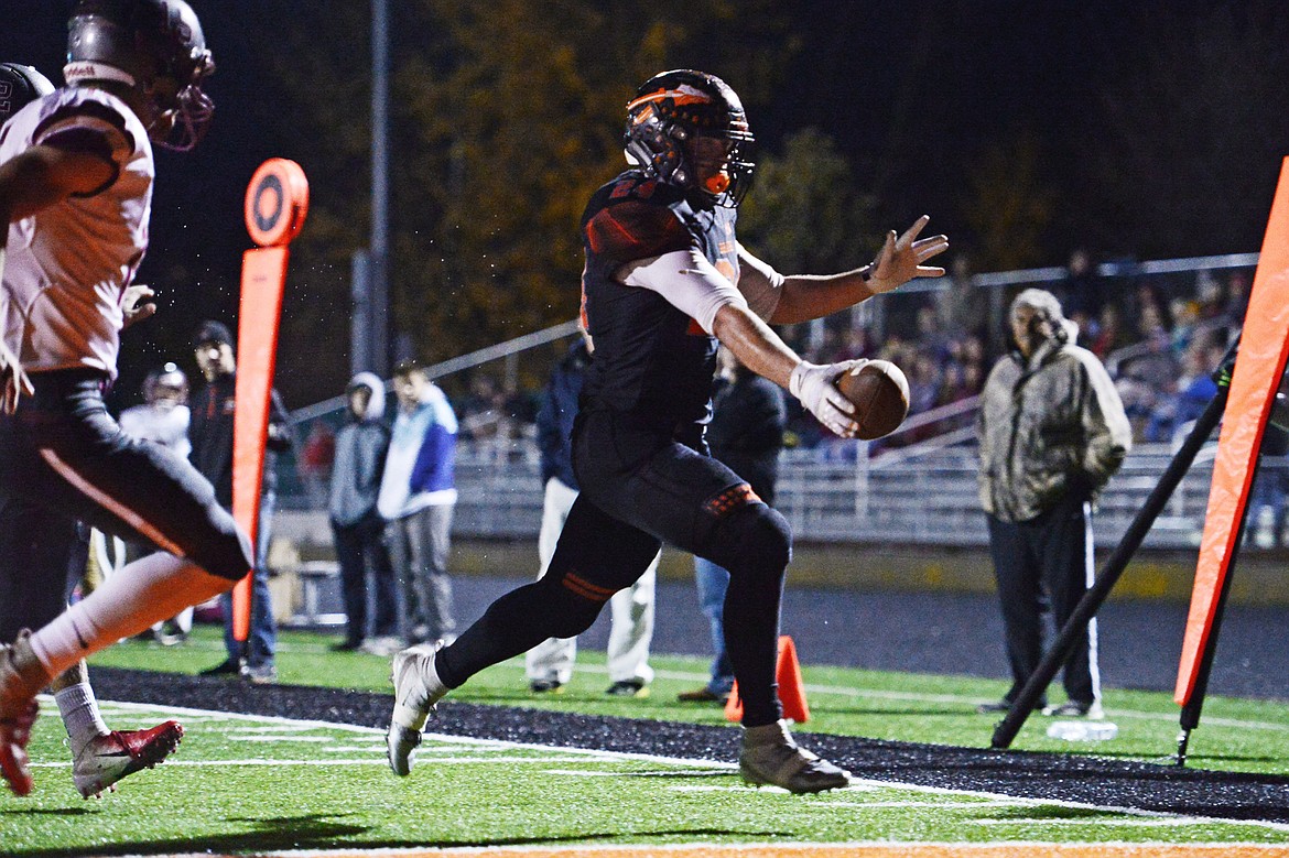 Flathead running back Blake Counts (24) crosses the end zone for a touchdown in the first quarter against Helena at Legends Stadium on Friday. (Casey Kreider/Daily Inter Lake)