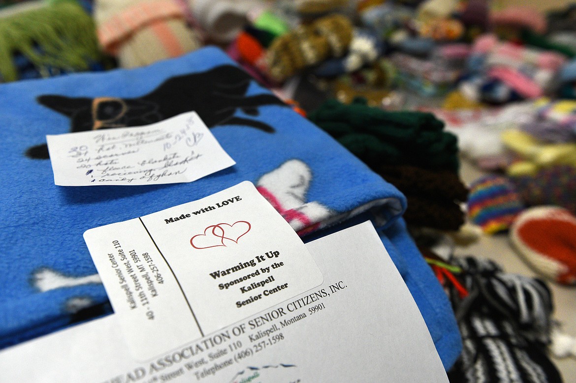 Donated items are organized on a table for the Kalispell Senior Center's winter clothing drive on Wednesday, Oct. 24. (Casey Kreider/Daily Inter Lake)