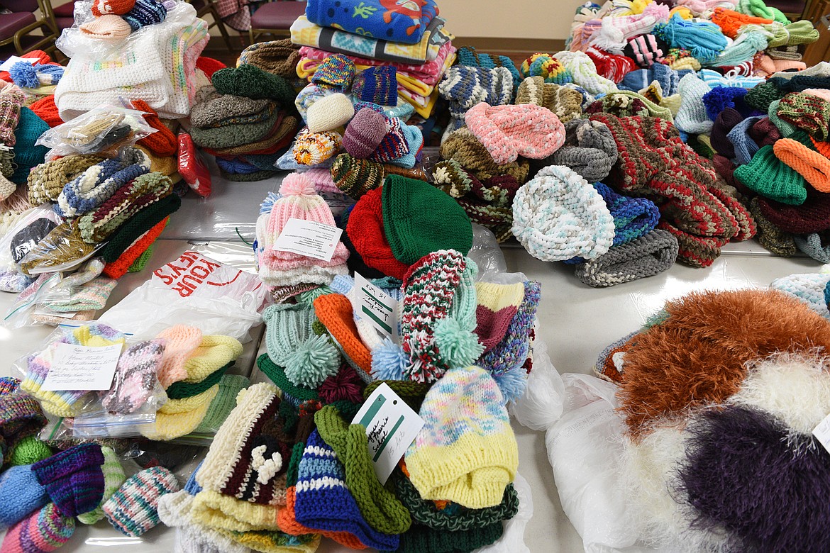 Donated items are organized on a table for the Kalispell Senior Center's winter clothing drive on Wednesday, Oct. 24. (Casey Kreider/Daily Inter Lake)