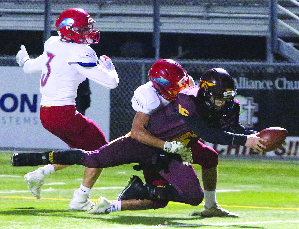 Connor Vanderweyst/Columbia Basin Herald
Moses Lake quarterback Logan Sperline reaches forward to cross the goal line. The play was negated due to two penalties.