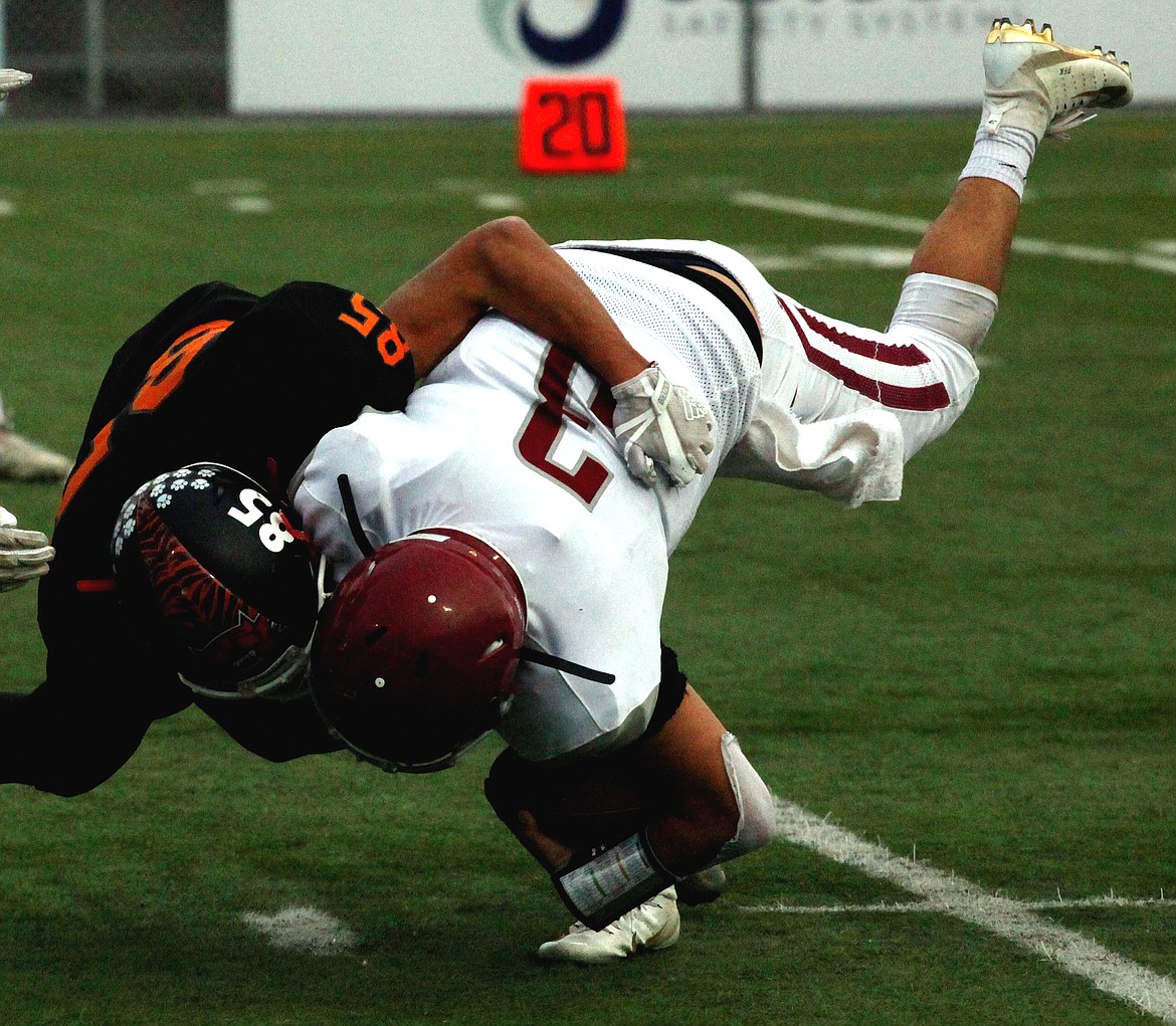 Rodney Harwood/Columbia Basin HeraldEphrata defensive back Valerio Placido-Barajas (85) takes down Toppenish quarterback Keyano Zamarripa during Saturday's CWAC game for third place at Lions Field in Moses Lake.