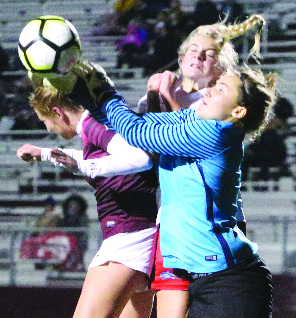 Connor Vanderweyst/Columbia Basin Herald
Moses Lake's Denali Knowles (maroon) tries to deflect a corner kick next to Eastmont goalie Kora Fry.