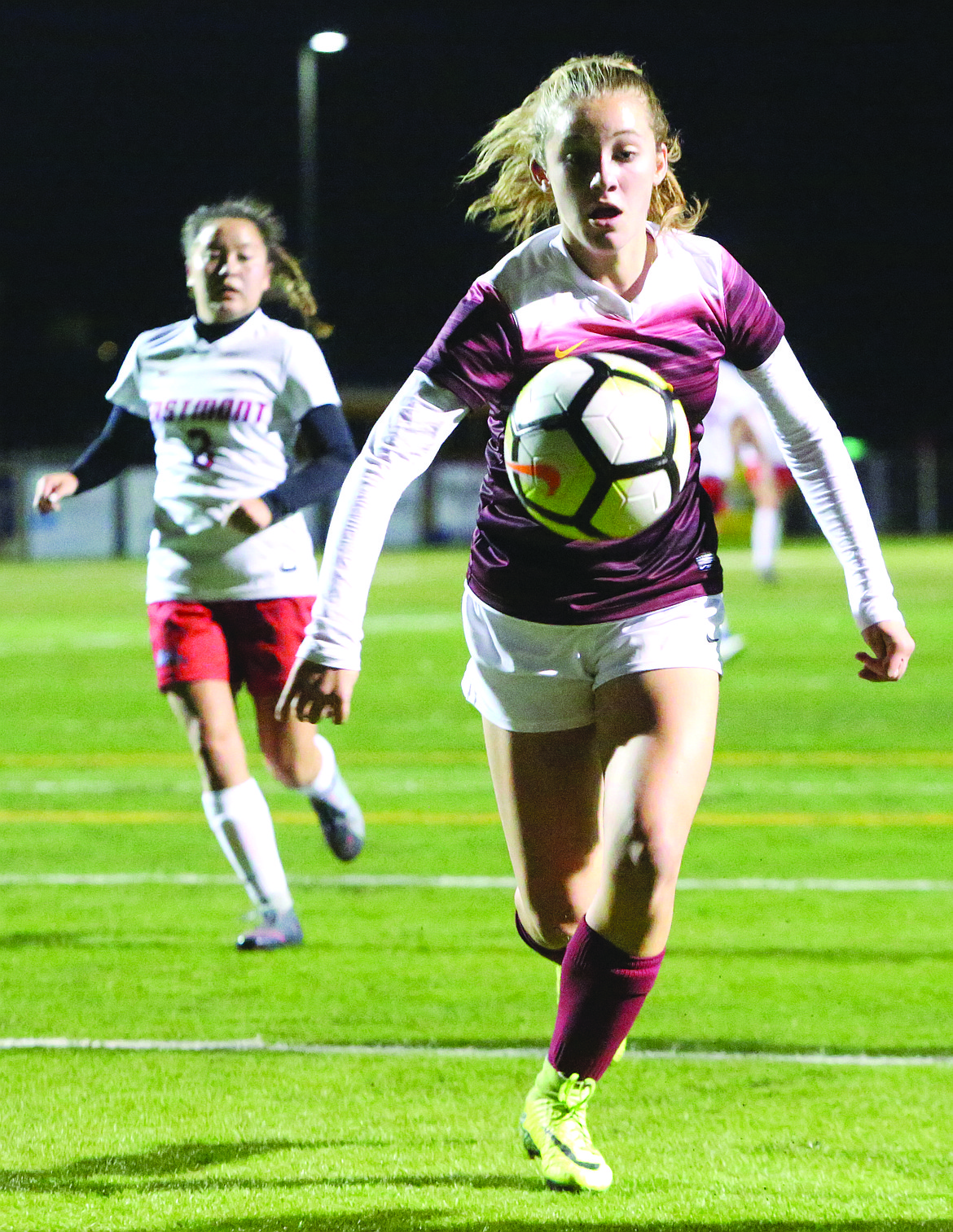 Connor Vanderweyst/Columbia Basin Herald
Moses Lake freshman Natalie Bunch chases down the ball against Eastmont.