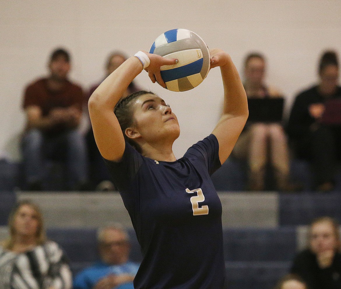 Timberlake High&#146;s McKeeley Tonkin sets the ball to a teammate during the 3A District 1 championship match against Kellogg.