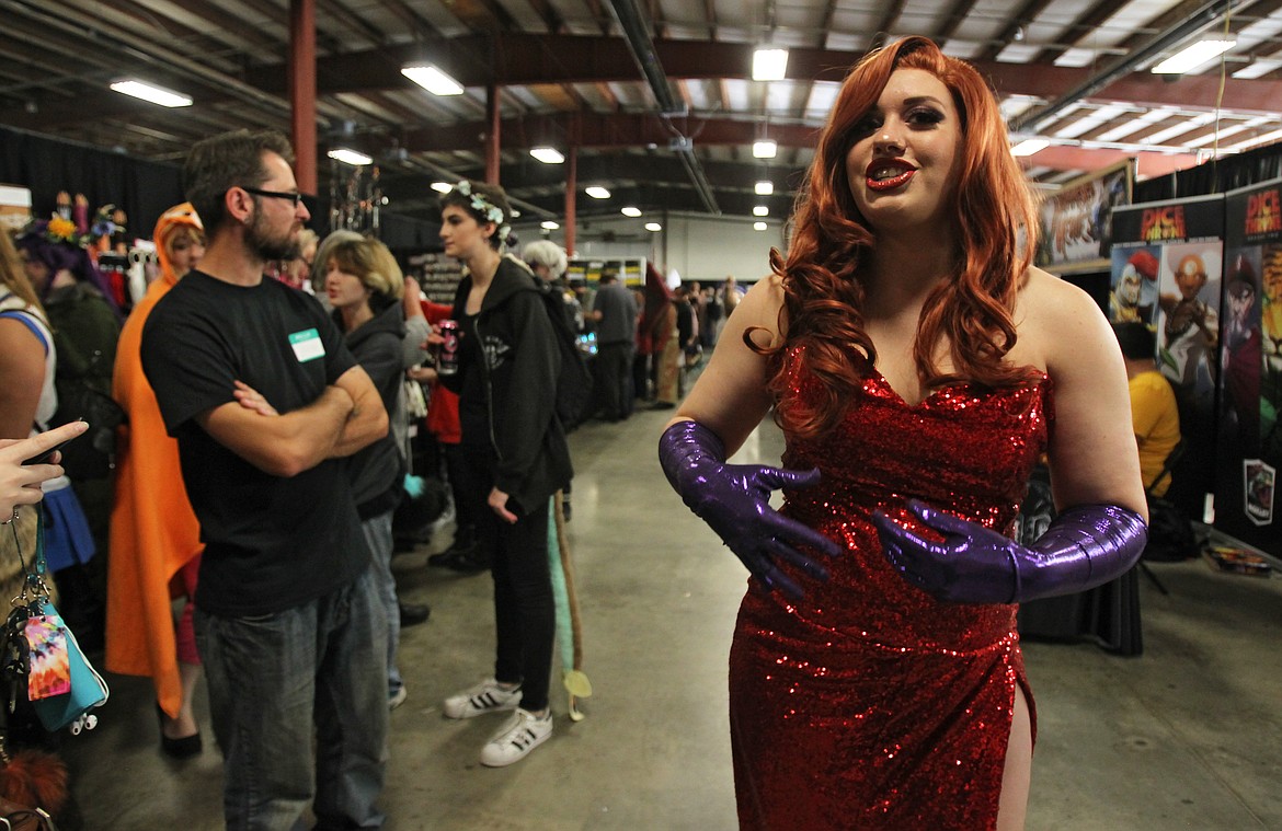 Dressed as &#147;Who Framed Roger Rabbit?&#148; sex symbol Jessica Rabbit, Kate Pasino discusses the joy she derives from dressing up in cosplay while attending the first Lake City Comicon at the Kootenai County Fairgrounds on Saturday. &#147;It was my favorite movie as a little girl,&#148; she said of the 1988 film. &#147;I just loved the costume, and I made it all myself. I love sewing. It was a challenge for me.&#148; (DEVIN WEEKS/Press)