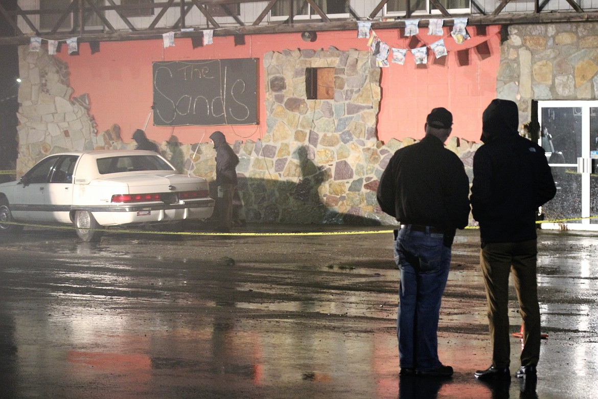 Sheriff Mike Gunderson and Deputy Prosecutor Benjamin Allen watch the investigation.