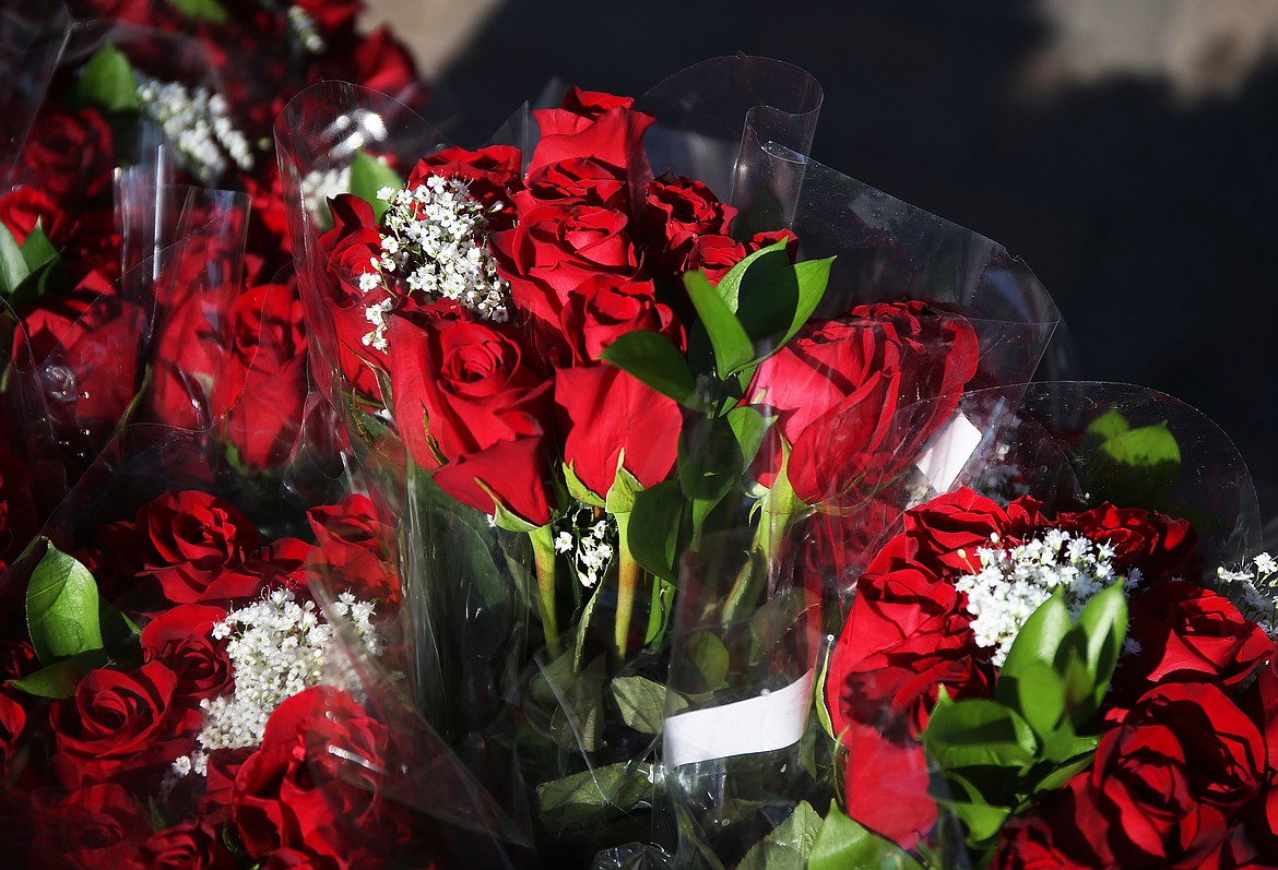 Over 1,300 bouquets of roses were delivered on Friday throughout the community by Coeur d'Alene Rotary Club members as a symbol of kindness. (LOREN BENOIT/Press)