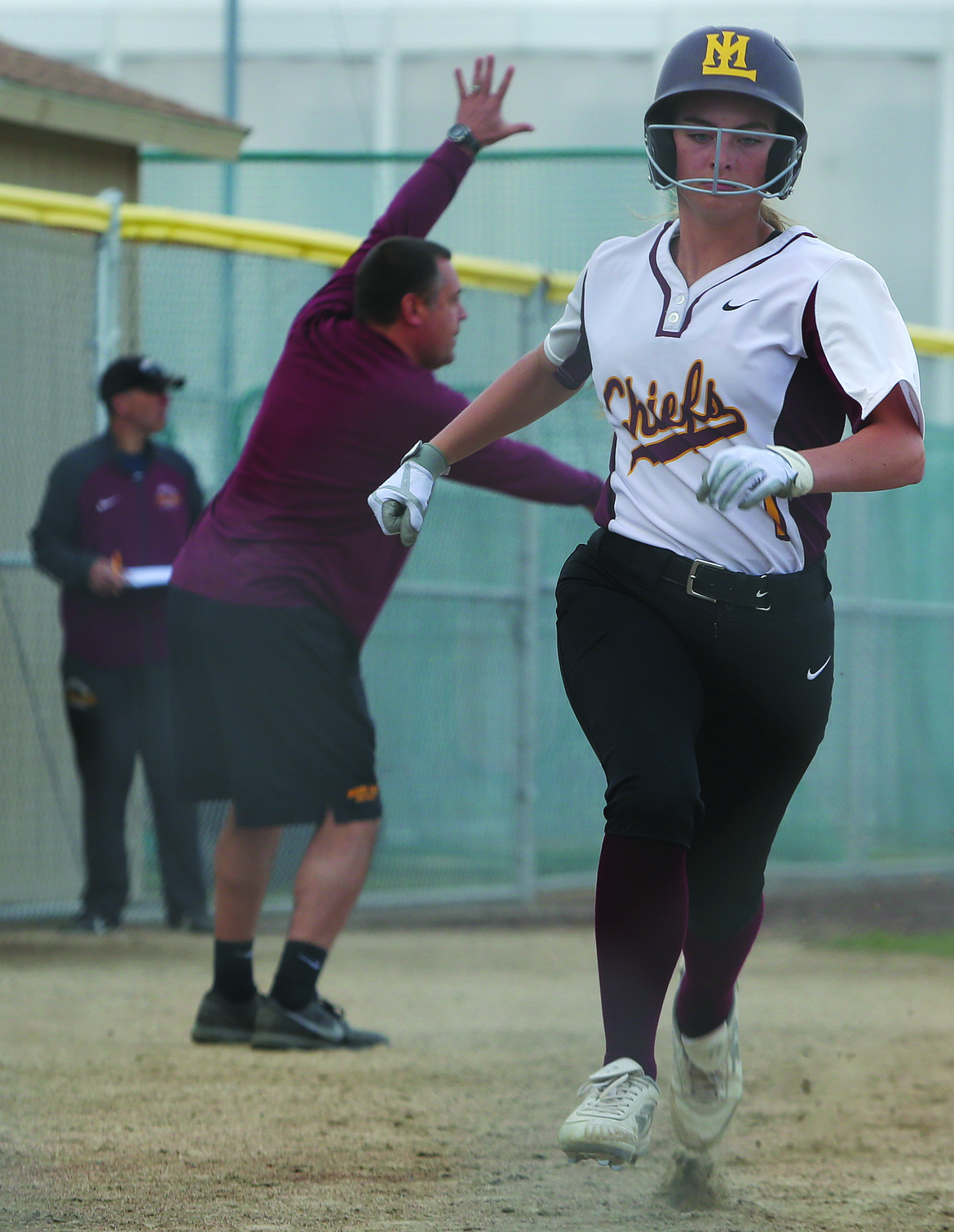 Connor Vanderweyst/Columbia Basin Herald
Moses Lake's Gina Skinner is waved home to score in the fifth inning against West Valley.