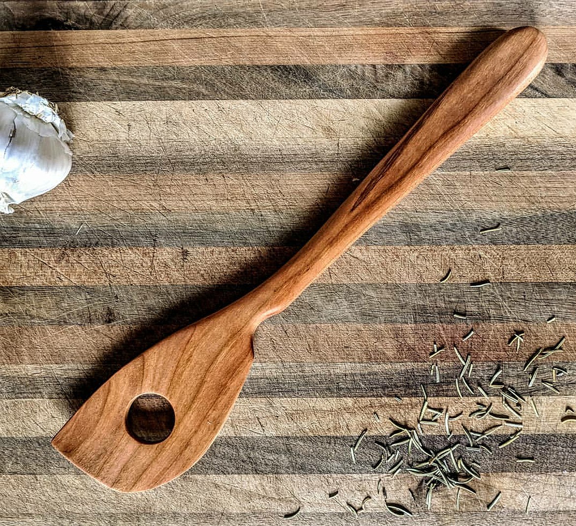 Great Bear Woodworks&#146; bladed mixing spoon made of cherry wood includes a flat edge for scraping and a curved blade to help with rounded bowls.  (Photo courtesy Great Bear Woodworks)