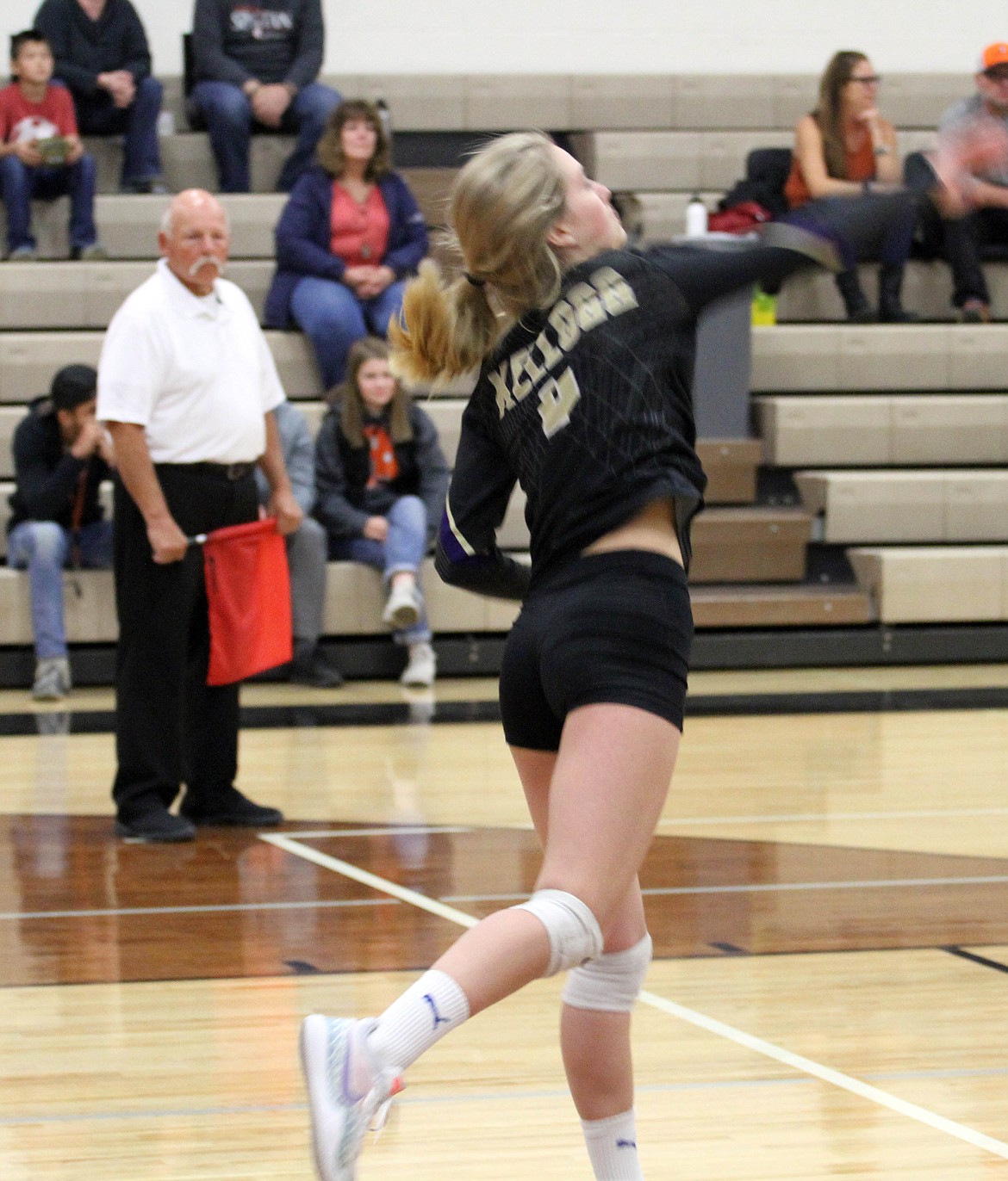 Photos by Josh McDonald
Grace Nearing serves the ball during the Wildcats&#146; district win over Priest River on Friday. At right, Kellogg celebrates winning a set over the host Spartans.