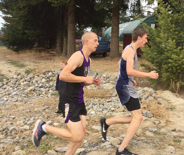 Courtesy photo
Kellogg cross country runner Jared White, left, keeps pace with his opposition during the 3A District 1 Meet on Oct. 18 in Bonners Ferry.