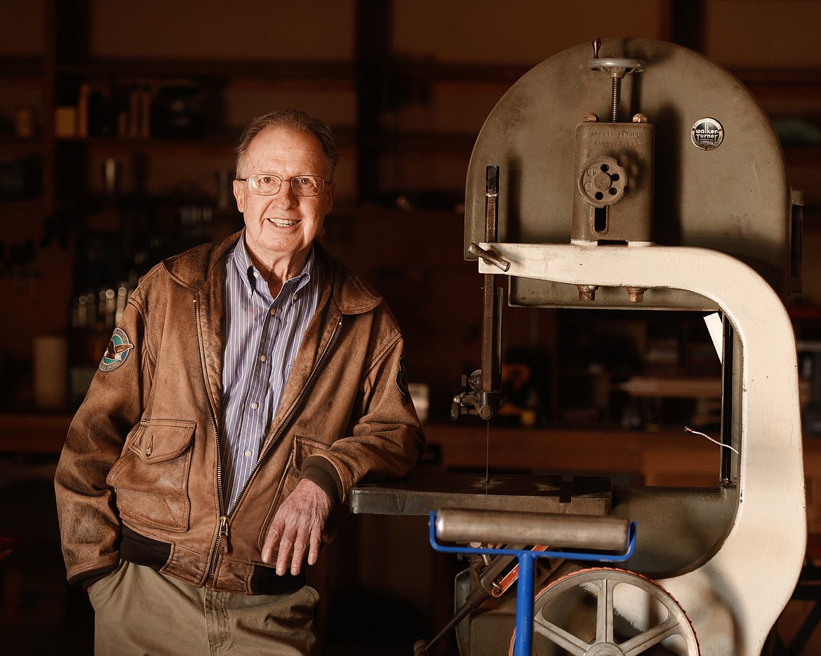 Steve Williams leans against a Walker-Turner 16-inch bandsaw in his workshop in Evergreen on Thursday, October 18. The saw is from 1939. He describes it as one he has mechanically restored, but has not yet cosmetically restored. &#147;It is second on the list for cosmetic restoration,&#148; said Williams. &#147;The problem is that it is such an important part of what I do, that I am having a hard time taking it out of use for a week to do the cosmetic work.&#148; (Brenda Ahearn photos/Daily Inter Lake)