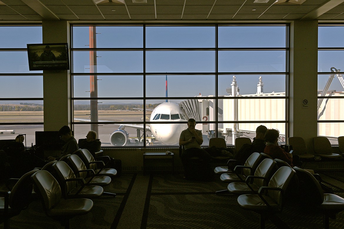 Passengers wait in a concourse at Glacier Park International Airport on Wednesday, Oct. 17. (Casey Kreider/Daily Inter Lake)