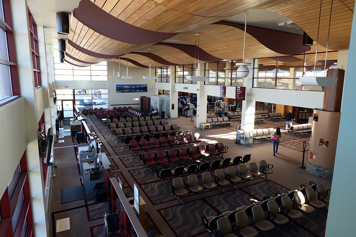 A passenger walks through an empty terminal at Glacier Park International Airport on Wednesday, Oct. 17. (Casey Kreider/Daily Inter Lake)