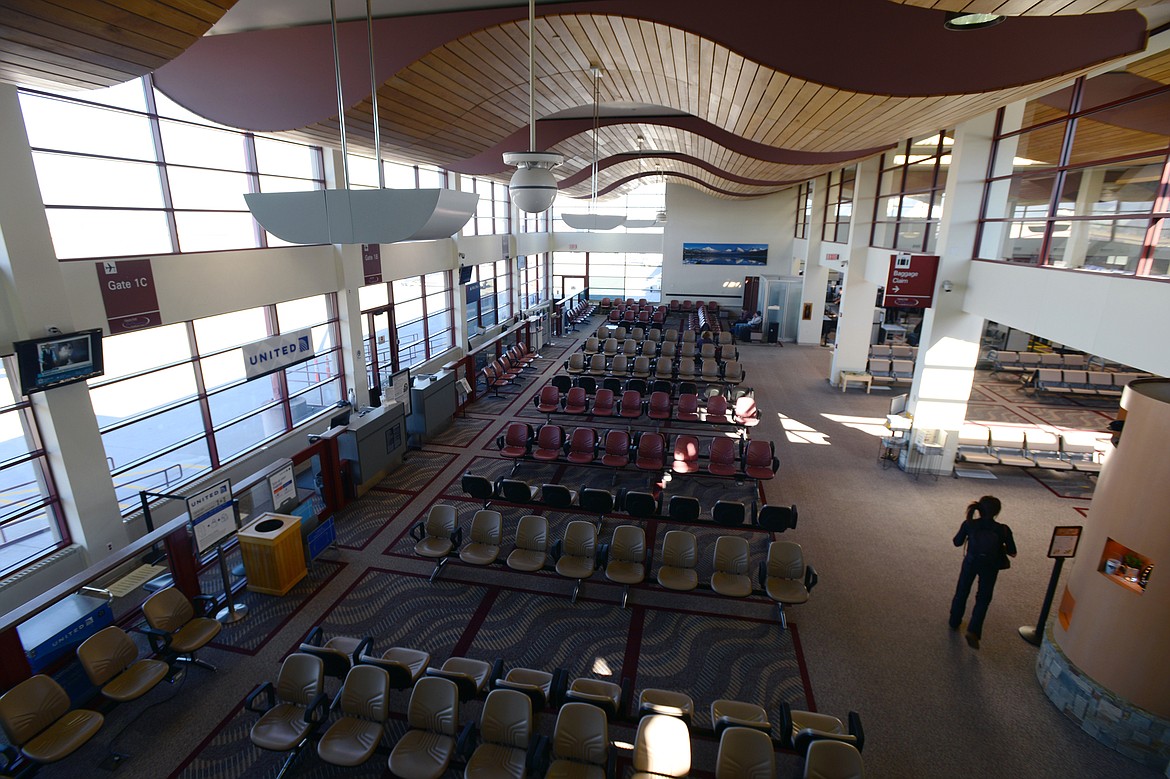 A passenger walks through an empty terminal at Glacier Park International Airport on Wednesday, Oct. 17. (Casey Kreider/Daily Inter Lake)