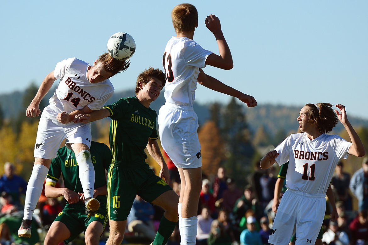 Frenchtown's Tradd Richardson (14) and Whitefish's Joseph Houston (15) battle for a header on a Whitefish corner kick in the second half at Smith Fields in Whitefish on Saturday. (Casey Kreider/Daily Inter Lake