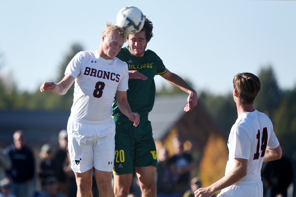 Whitefish's Sam Menicke (20) and Frenchtown's Jeff Jacobs (8) battle for a header in front of the Frenchtown goal in the second half at Smith Fields in Whitefish on Saturday. (Casey Kreider/Daily Inter Lake)