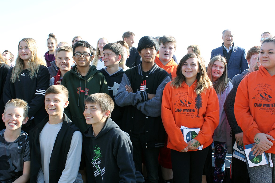 Emry Dinman/Sun Tribune - Students from Lind-Ritzville Middle School joined Governor Jay Inslee, pictured top-right, for the ribbon cutting ceremony of the Adams Nielson Solar Farm, the largest of its kind in Washington.