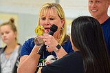 Pucker up for Porky Kids meet fundraising goal, principal kisses pig
