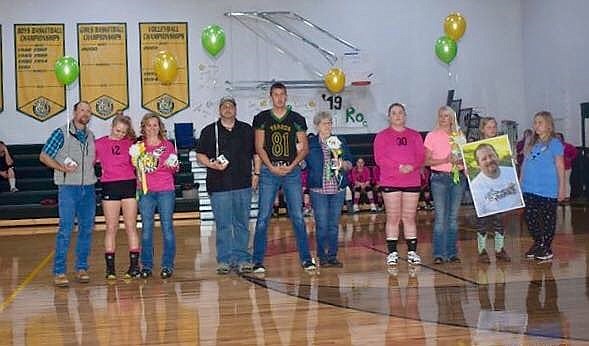 St. Regis Senior Night was on Oct. 17 and players were escorted by family members. Pictured, left to right, are Emma Hill and her parents Devin and Tina; J.D. Booker, with Jim and Donna Booker; and McKenzie Stortz with Amy Stortz and her sisters. (Photo courtesy of St. Regis Fan Club)