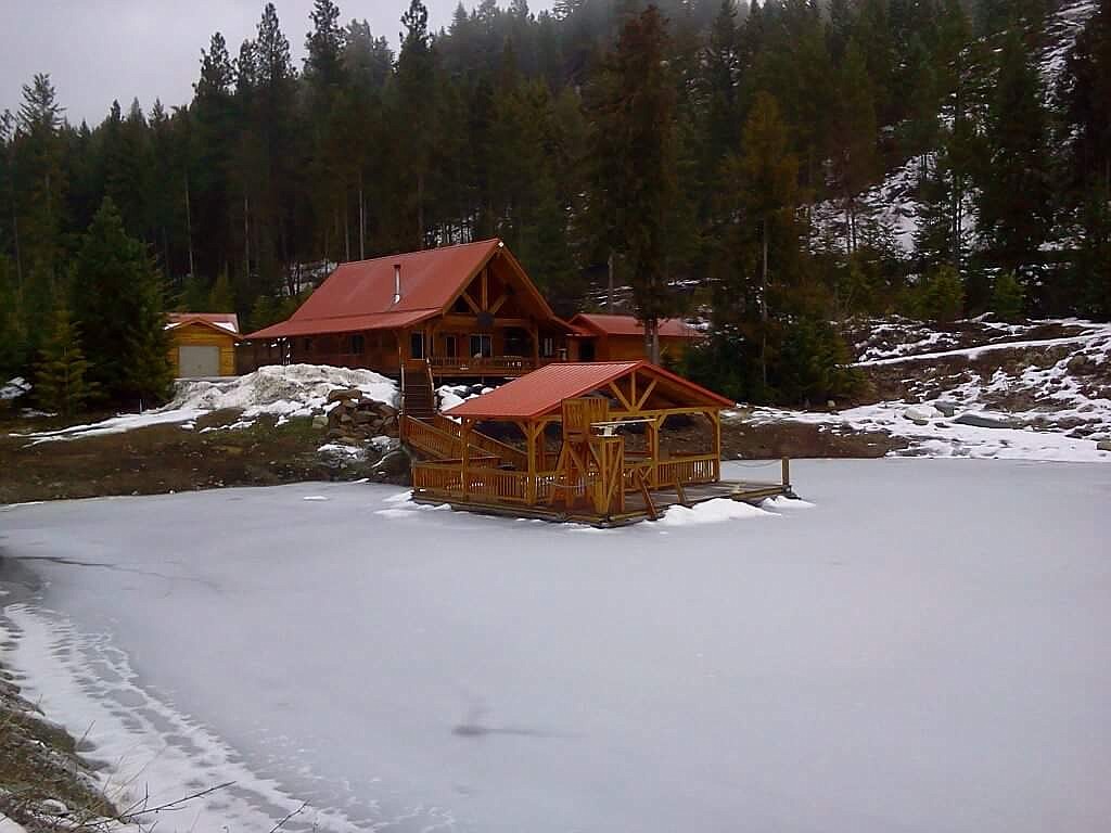 (Courtesy Photo)
This house has a walkway down to the covered boat dock surrounded by an icy pond.